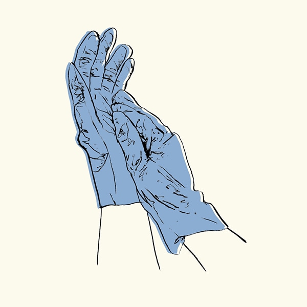 Putting On a Pair Of Compostable Blue Gloves