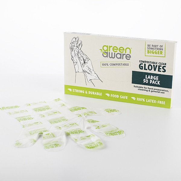 50 pack of large clear gloves with a pair of clear gloves lying in front