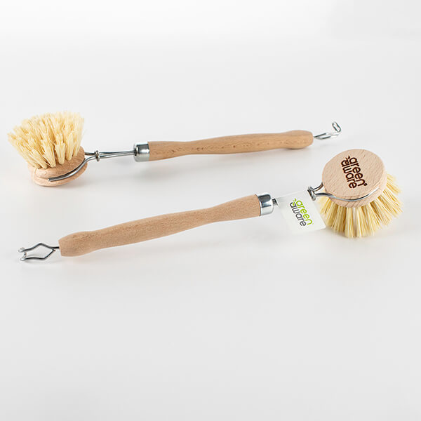 Two wooden dish brushes lying on a table